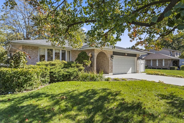 single story home with a front lawn and a garage