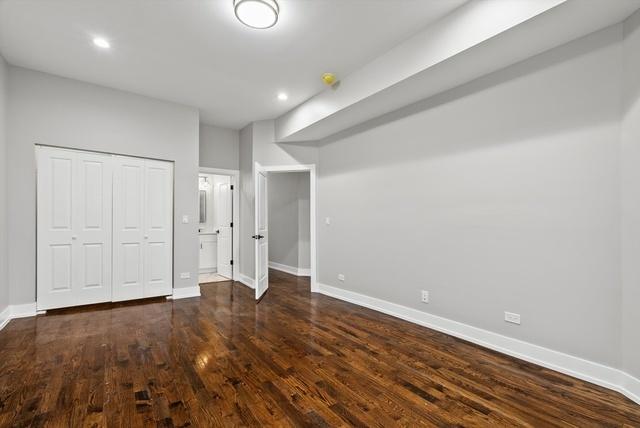 unfurnished bedroom featuring dark wood-type flooring and a closet