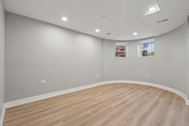 spare room with light hardwood / wood-style flooring