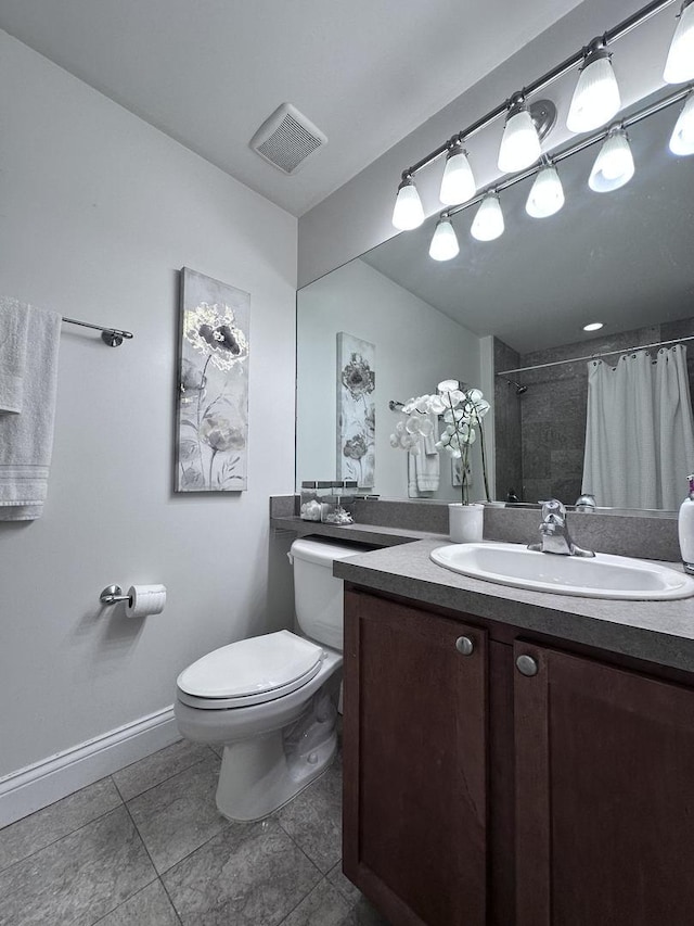 bathroom with a shower with curtain, tile patterned floors, vanity, and toilet