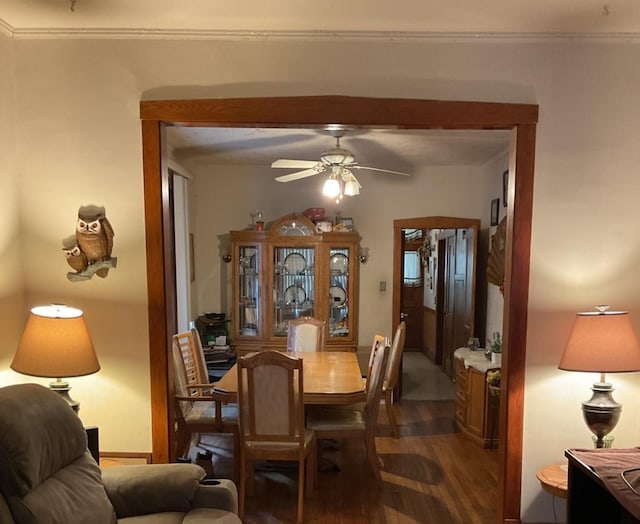 dining area featuring ceiling fan, dark hardwood / wood-style flooring, and ornamental molding