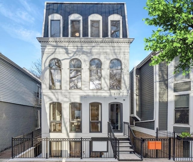 view of front of property with mansard roof and entry steps