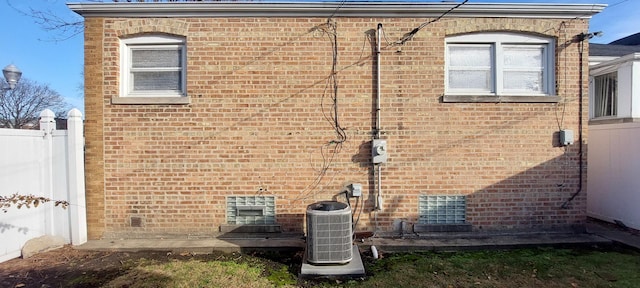 view of side of property with central AC