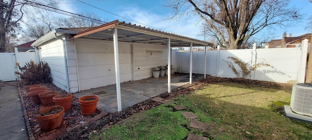 view of outbuilding with a yard and central AC