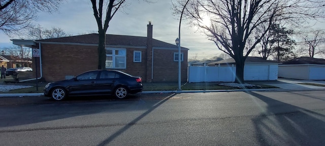 view of front of home featuring an outdoor structure and a garage