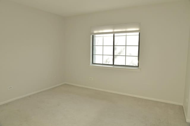 unfurnished room with light carpet