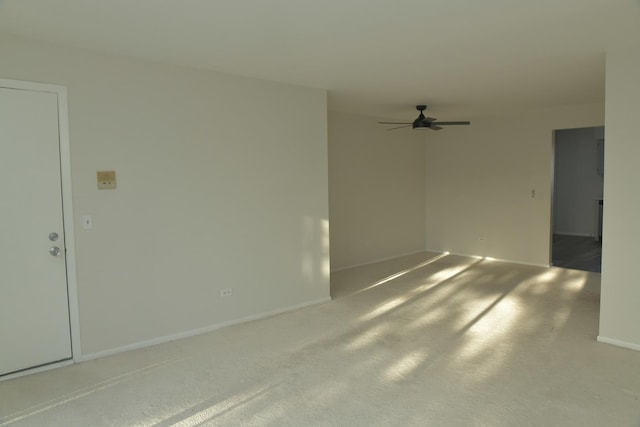 unfurnished room with carpet and ceiling fan