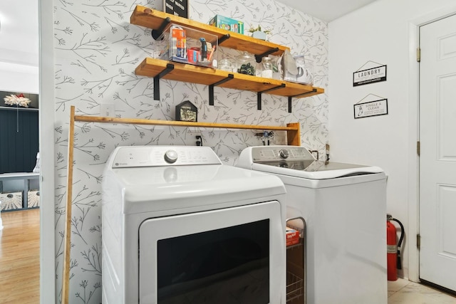 clothes washing area with washer and dryer