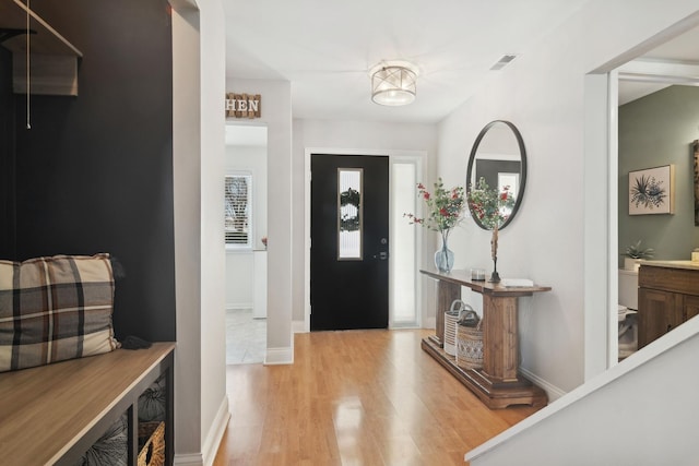 entryway with light hardwood / wood-style floors