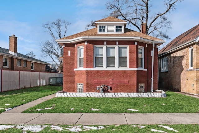 bungalow with a front yard