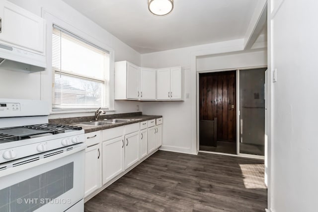 kitchen with sink, white cabinets, white gas range oven, and dark hardwood / wood-style flooring