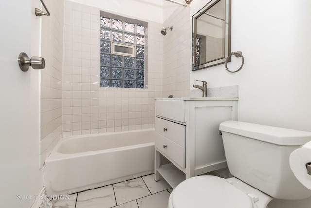 full bathroom with toilet, tiled shower / bath, and vanity