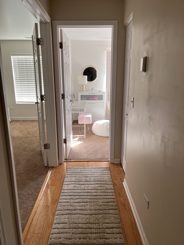 hallway featuring light wood-type flooring