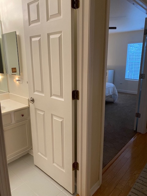 bathroom featuring vanity and wood-type flooring