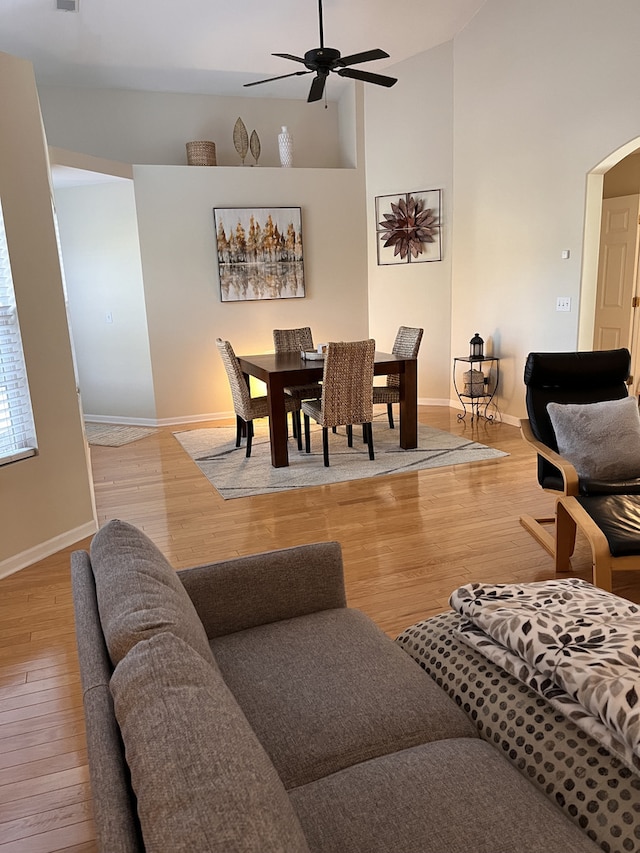 living room with ceiling fan and light hardwood / wood-style floors