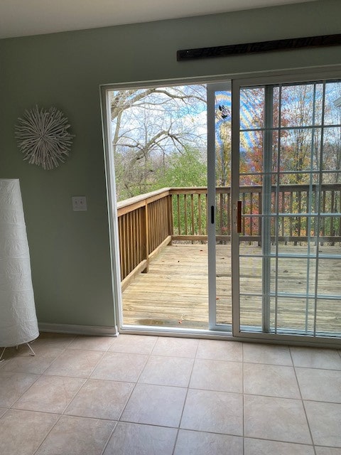 entryway with light tile patterned flooring