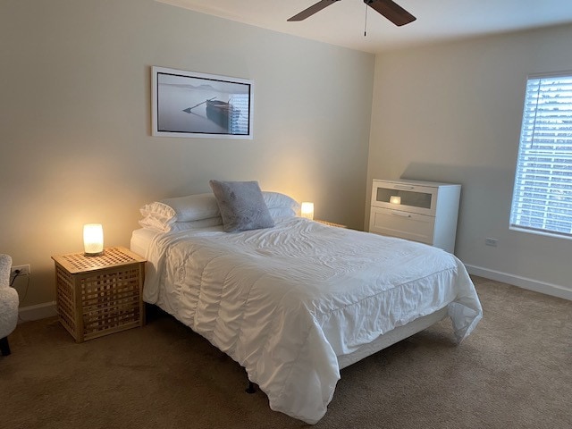 carpeted bedroom featuring ceiling fan