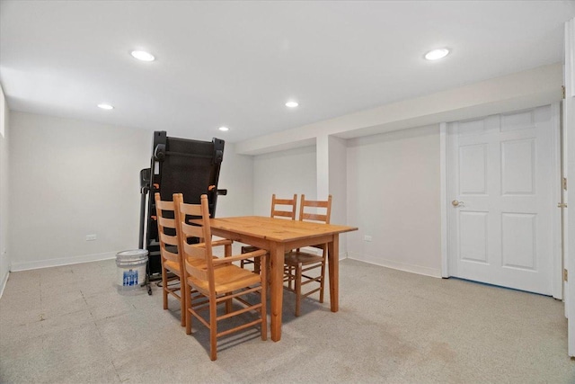 dining space with light colored carpet