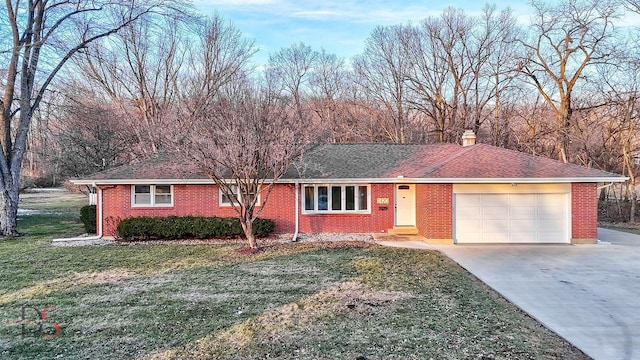 single story home with a garage and a front lawn