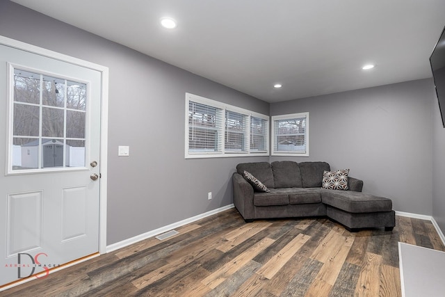 living room with dark wood-type flooring