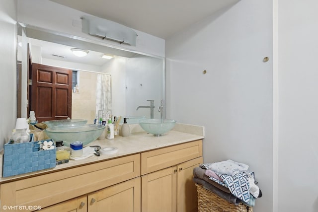 bathroom featuring vanity and walk in shower