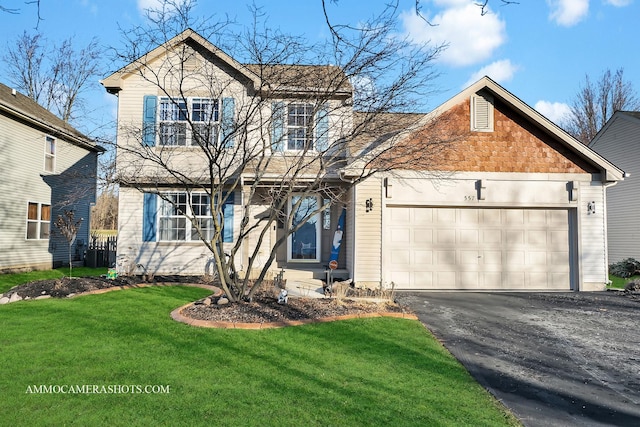 view of front property with a garage and a front lawn