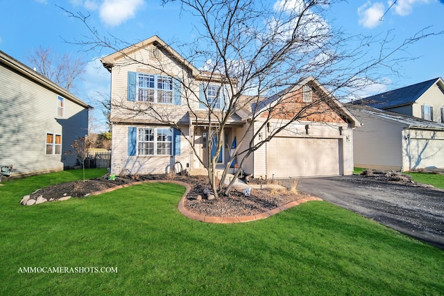 view of front property with a front yard and a garage