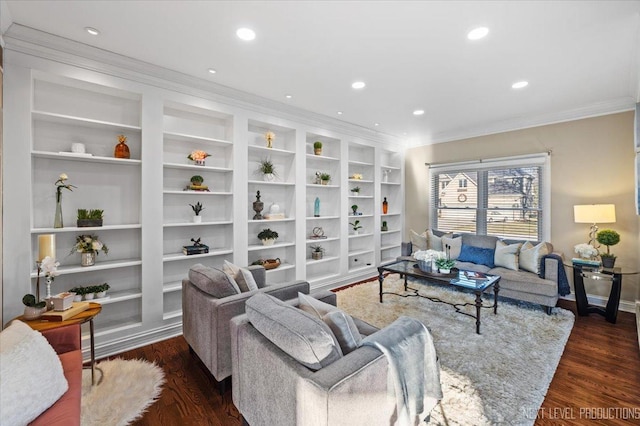 living room featuring dark hardwood / wood-style flooring, built in features, and ornamental molding