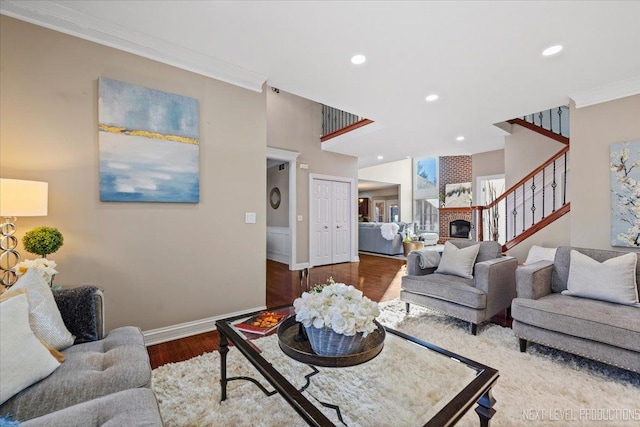 living room with crown molding and dark hardwood / wood-style flooring