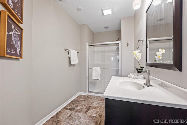 bathroom featuring vanity and an enclosed shower