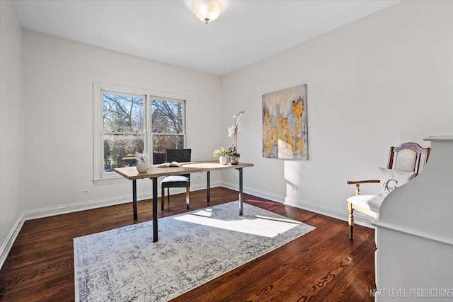 office with dark wood-type flooring