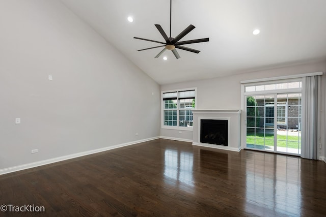 unfurnished living room with ceiling fan, dark hardwood / wood-style flooring, and high vaulted ceiling