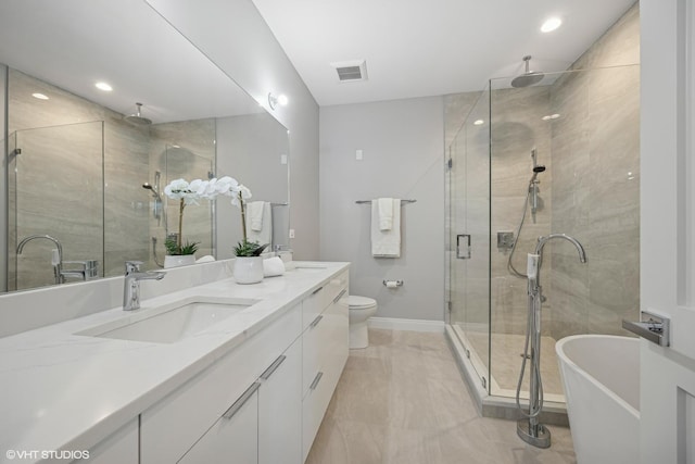 full bathroom featuring toilet, vanity, and separate shower and tub