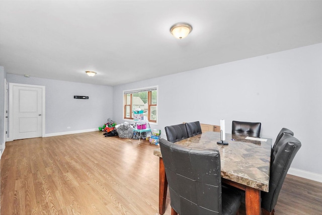 dining area featuring wood-type flooring