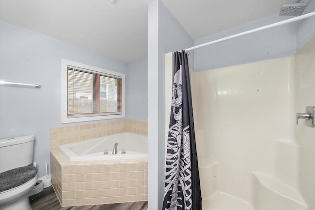 bathroom featuring plus walk in shower, hardwood / wood-style floors, and toilet