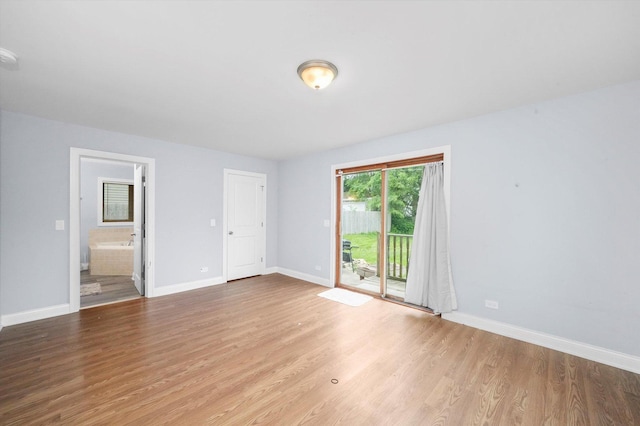 unfurnished room featuring wood-type flooring