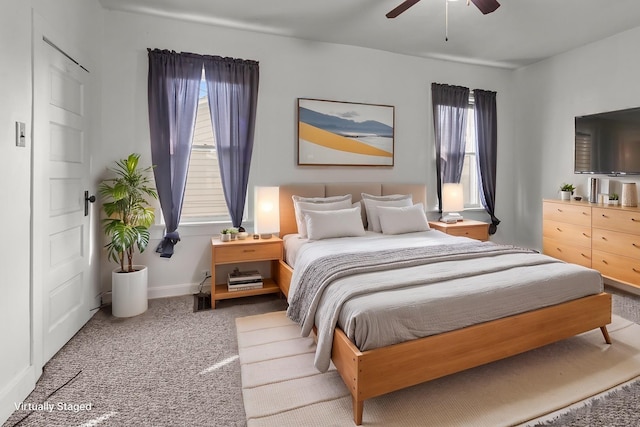 carpeted bedroom featuring ceiling fan