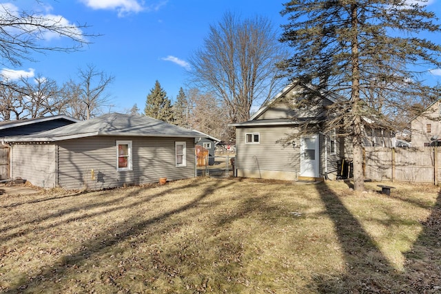 view of side of home with a yard