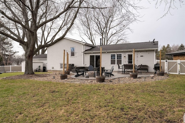 back of property featuring a lawn and a patio area