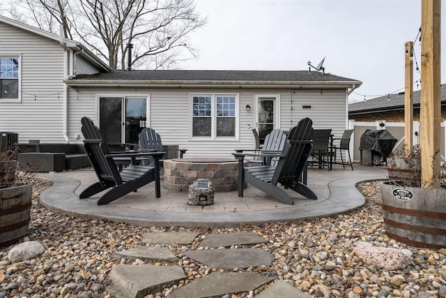 rear view of property featuring a patio area