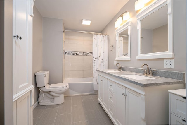 full bathroom with vanity, toilet, and shower / tub combo with curtain