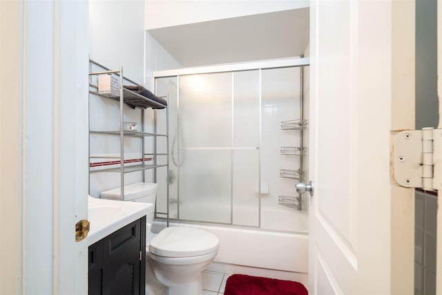 full bathroom with vanity, toilet, and bath / shower combo with glass door