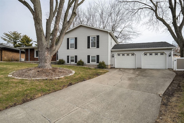 view of front of property with a garage and a front lawn