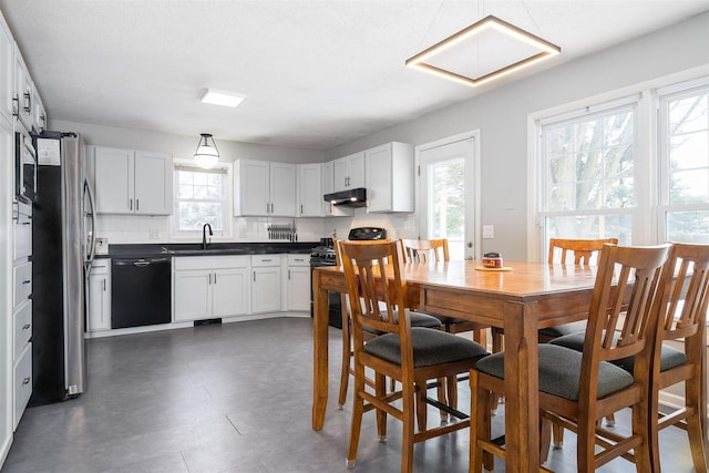 kitchen with stainless steel fridge, sink, range, black dishwasher, and white cabinetry