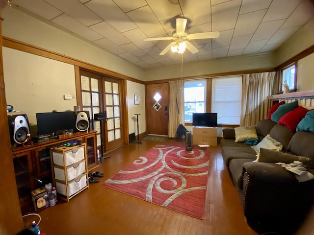 living room featuring hardwood / wood-style flooring and ceiling fan