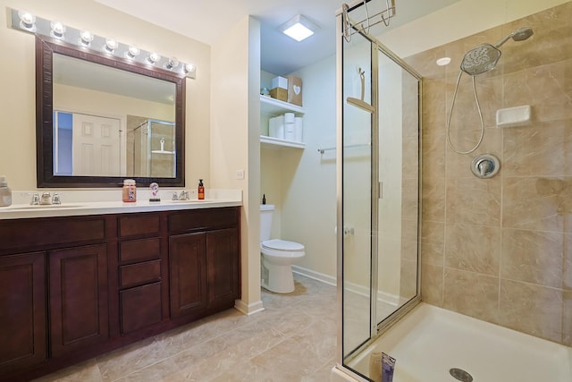 bathroom with tile patterned flooring, vanity, toilet, and a shower with door