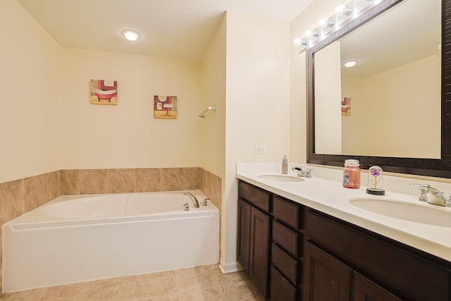 bathroom with a washtub and vanity