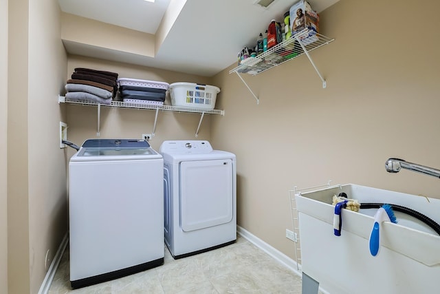 laundry area featuring independent washer and dryer