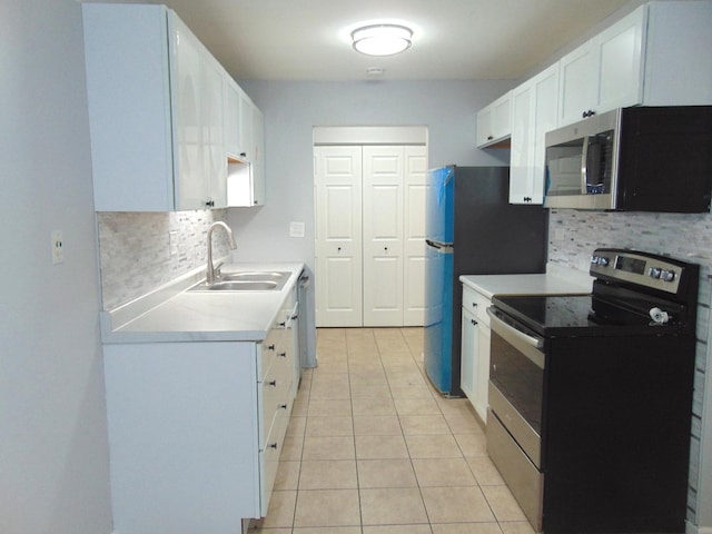 kitchen with decorative backsplash, sink, white cabinets, and stainless steel appliances