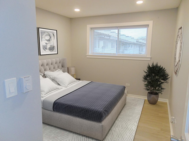 bedroom with light wood-type flooring